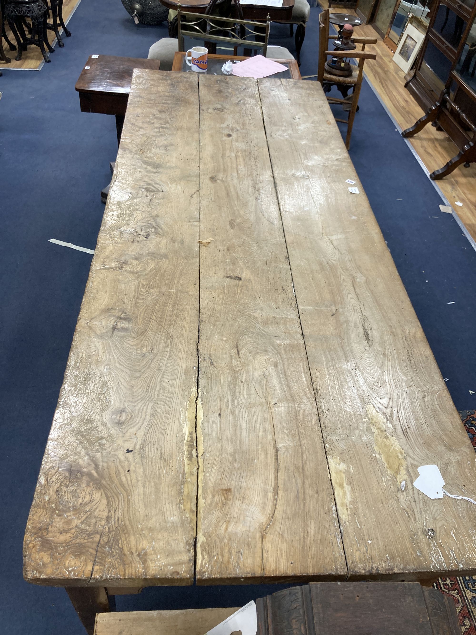 A large 19th century elm kitchen table fitted three drawers, length 227cm, width 88cm, height 80cm